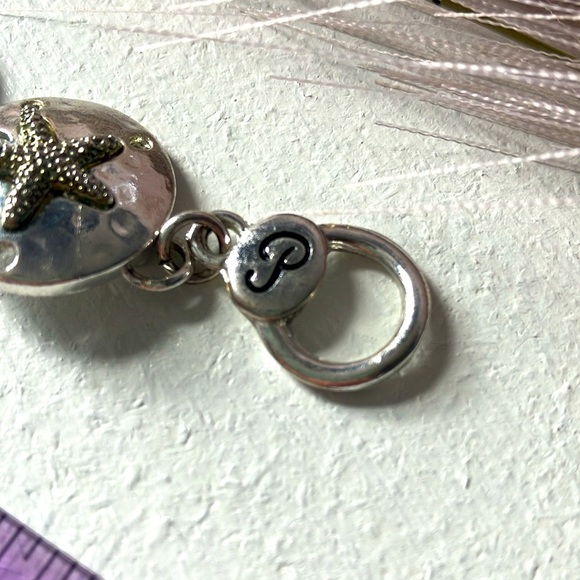 Silver sand dollar link bracelet. 7” includes clasp. - Picture 7 of 7